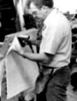 Upholsterer applying SuperFelt padding.